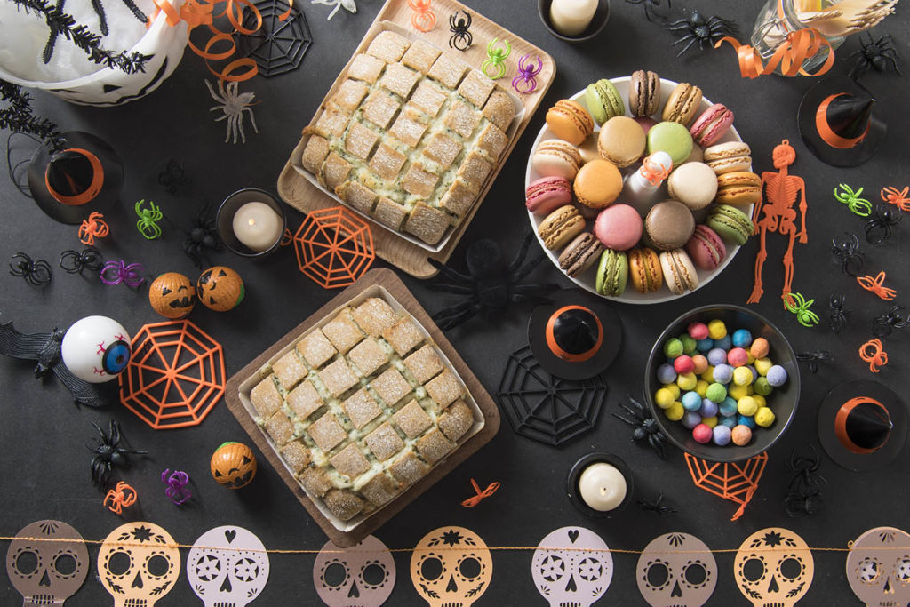 Halloween table with macarons and cheese bread