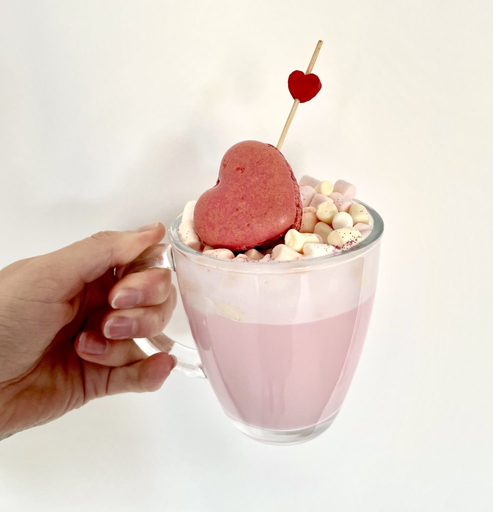 Hot chocolate with heart shaped macaron